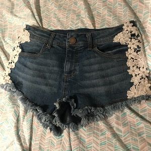 Jean shorts with white lace lines down the side!